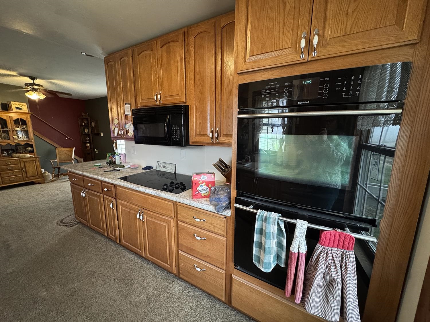 27375 Highway 40 Chadwick, IL 61014 - Photo 18 of 39 a kitchen with stainless steel appliances wooden cabinets and a stove top oven