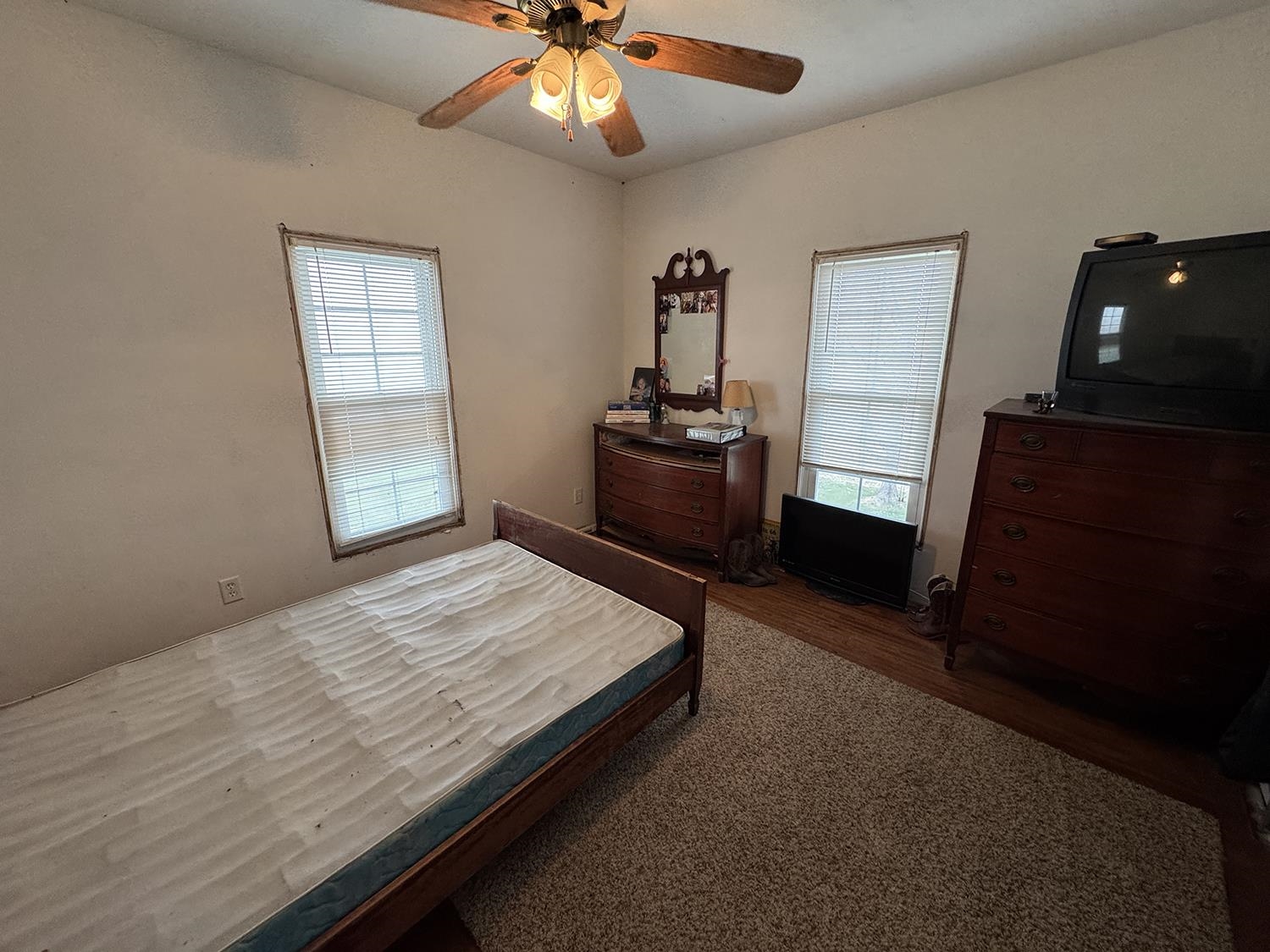 27375 Highway 40 Chadwick, IL 61014 - Photo 29 of 39 a bedroom with a bed and a chandelier