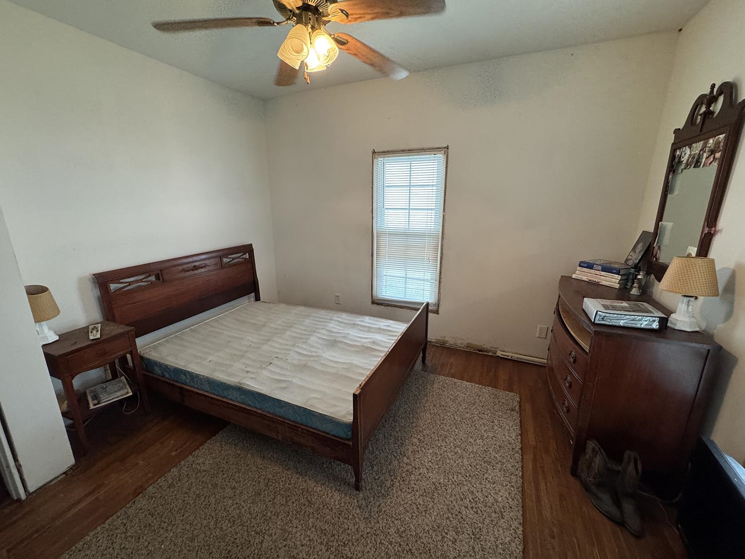 27375 Highway 40 Chadwick, IL 61014 - Photo 30 of 39 a bedroom with a bed and a chandelier