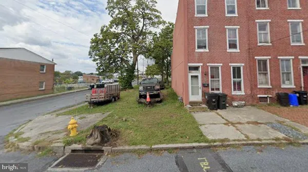 a car parked in front of brick building