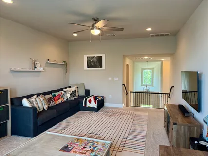 a bedroom with furniture and a book shelf