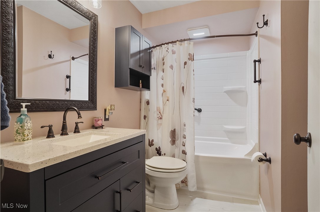 1533 Old Forge Road Kent, OH 44240 - Photo 20 of 33 Bathroom with vanity, toilet, and shower / tub combo with curtain