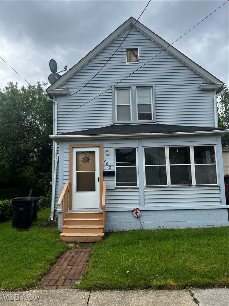362 Howe Street Akron, OH 44307 - Photo 2 of 23 View of front facade with entry steps and a front yard
