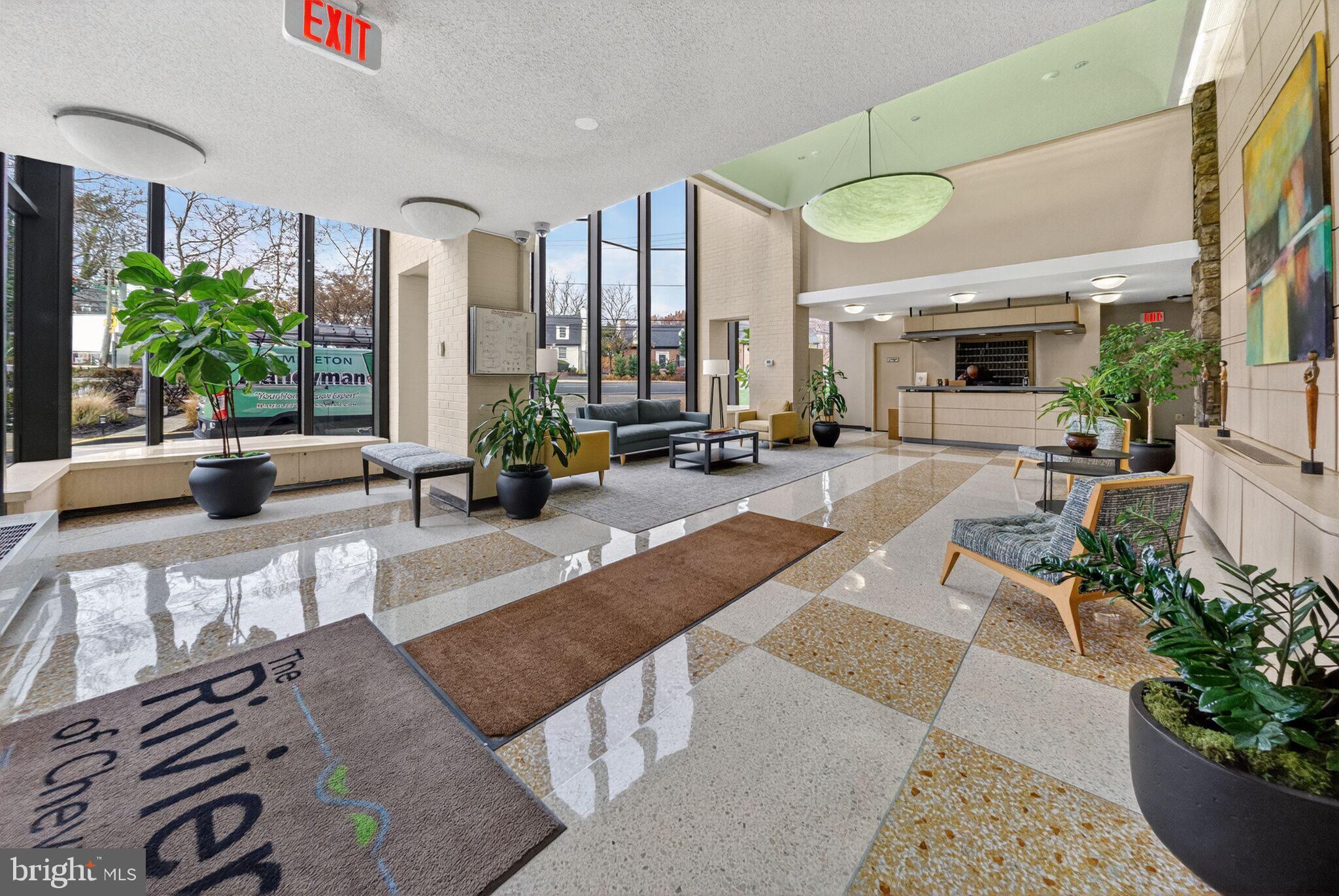 4242 East-West Highway, Unit 714 Chevy Chase, MD 20815 - Photo 2 of 29 Beautiful Lobby with Front Desk