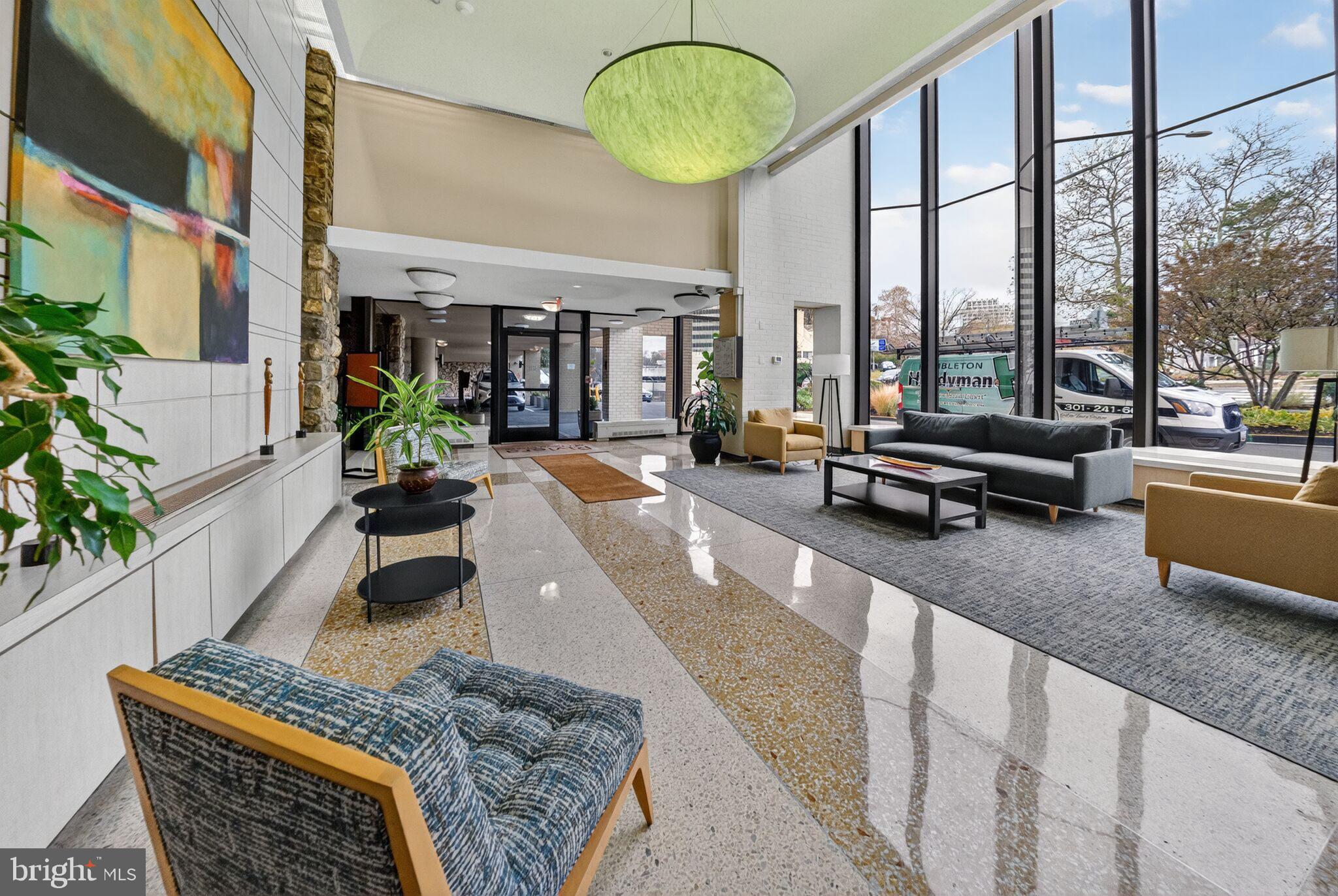 4242 East-West Highway, Unit 714 Chevy Chase, MD 20815 - Photo 3 of 29 Beautiful Lobby with Front Desk