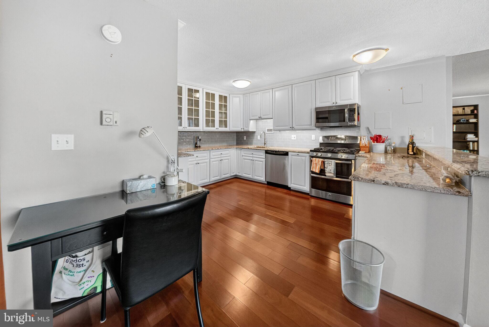 4242 East-West Highway, Unit 714 Chevy Chase, MD 20815 - Photo 8 of 29 Renovated Kitchen with granite counters