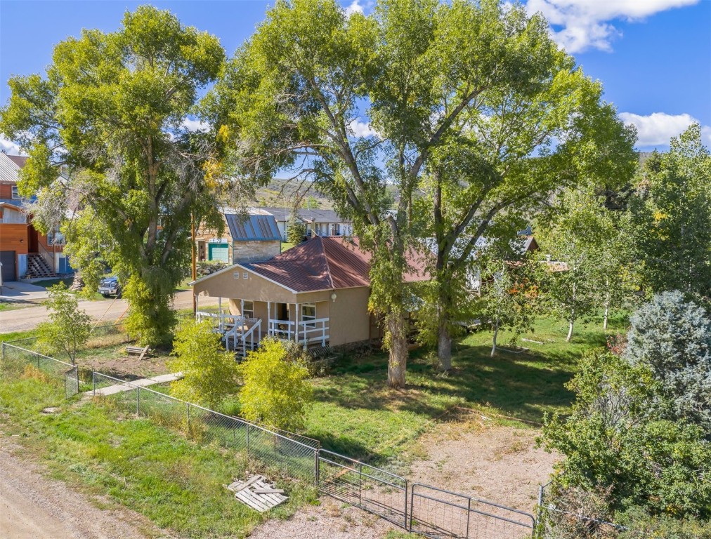 a view of house with yard