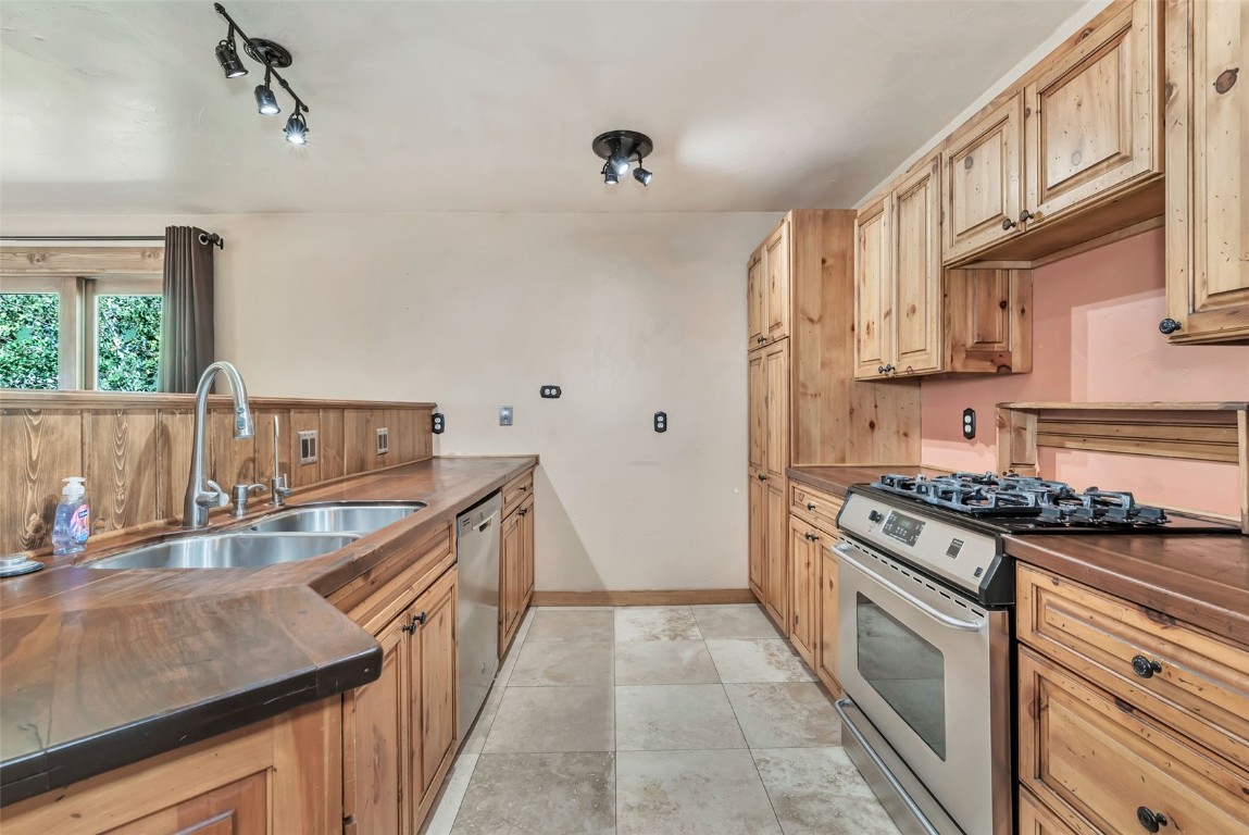 21505 4th Avenue Phippsburg, CO 80469 - Photo 11 of 44 a kitchen with stainless steel appliances granite countertop a sink stove and refrigerator