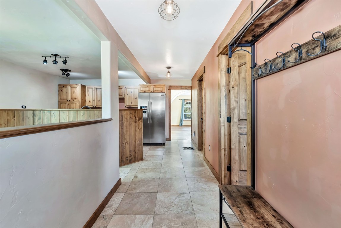 21505 4th Avenue Phippsburg, CO 80469 - Photo 18 of 44 a view of a hallway with wooden shelves