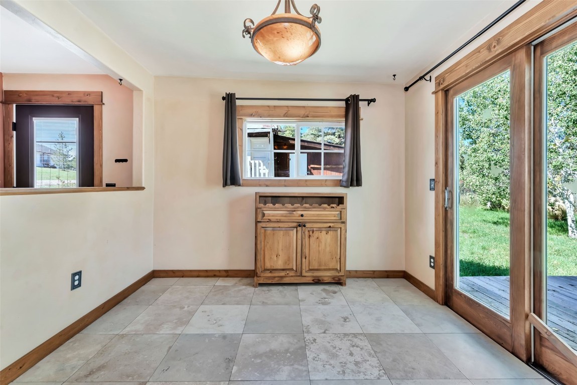 21505 4th Avenue Phippsburg, CO 80469 - Photo 19 of 44 a view of a room with wooden floor and windows