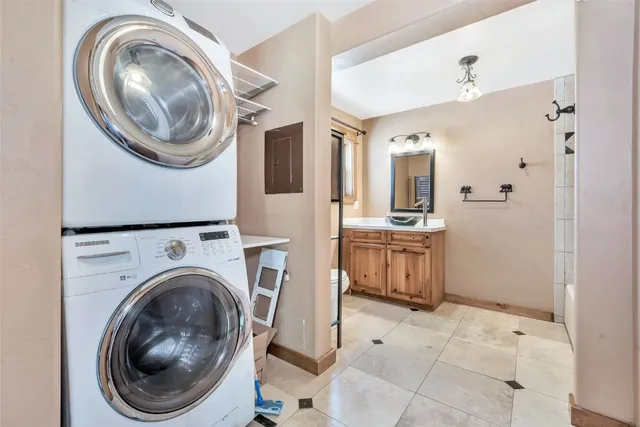 a view of a hallway with washer and dryer