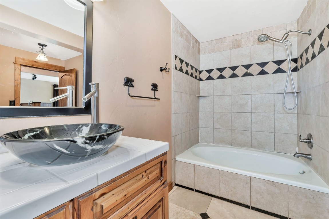 21505 4th Avenue Phippsburg, CO 80469 - Photo 27 of 44 a bathroom with a tub sink and mirror