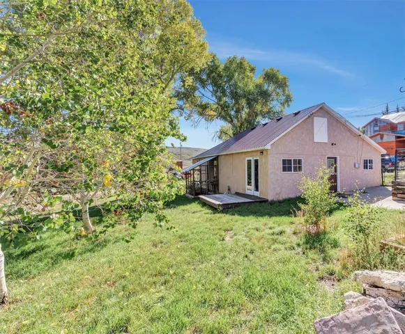 a view of a house with a yard