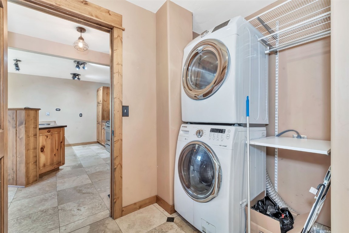 21505 4th Avenue Phippsburg, CO 80469 - Photo 32 of 44 a view of a hallway with washer and dryer