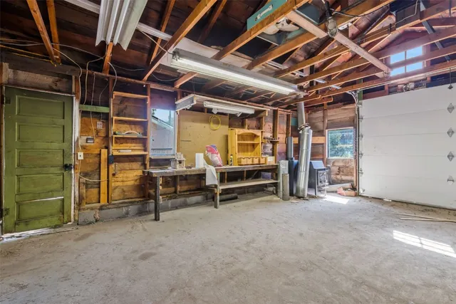 a view of an empty room with a fireplace