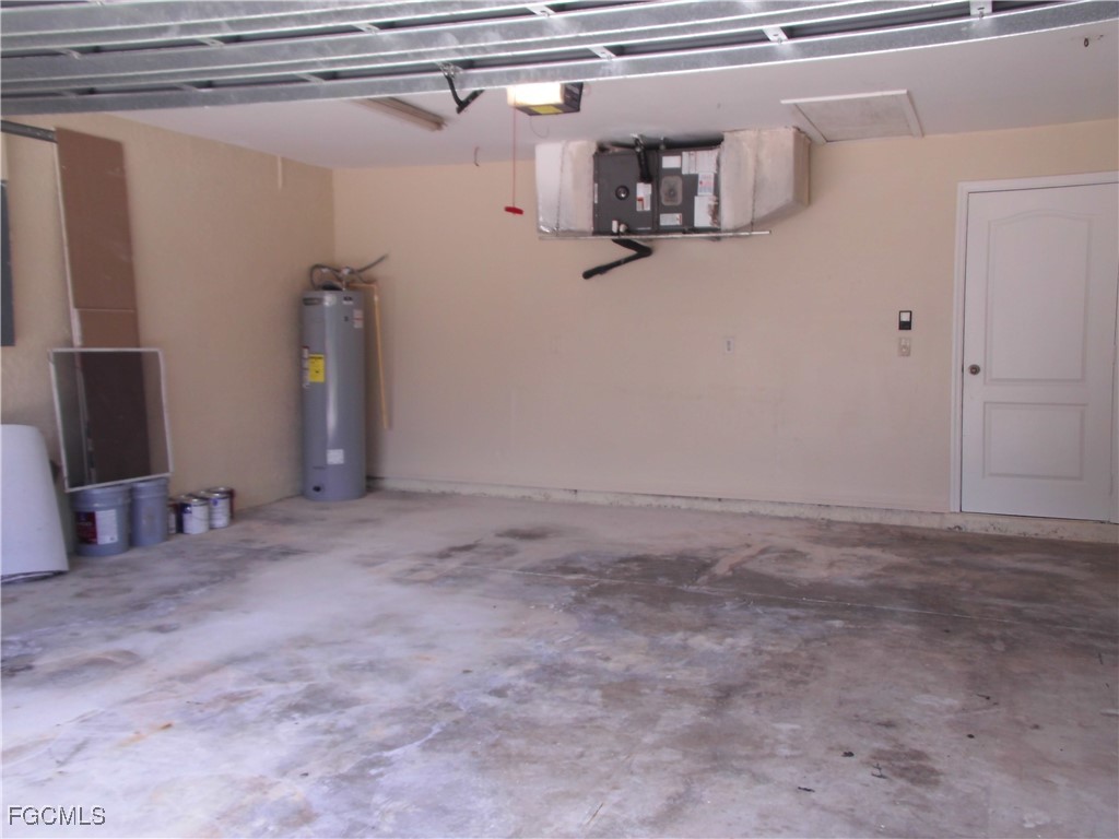 1117 Venetia Street Lehigh Acres, FL 33974 - Photo 9 of 10 a view of a room with rack on the wall