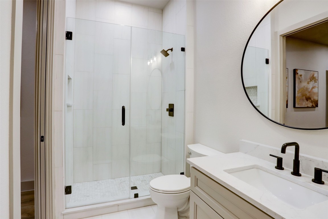 104 Turney Trace Round Top, TX 78954 - Photo 16 of 17 a bathroom with a sink toilet and shower