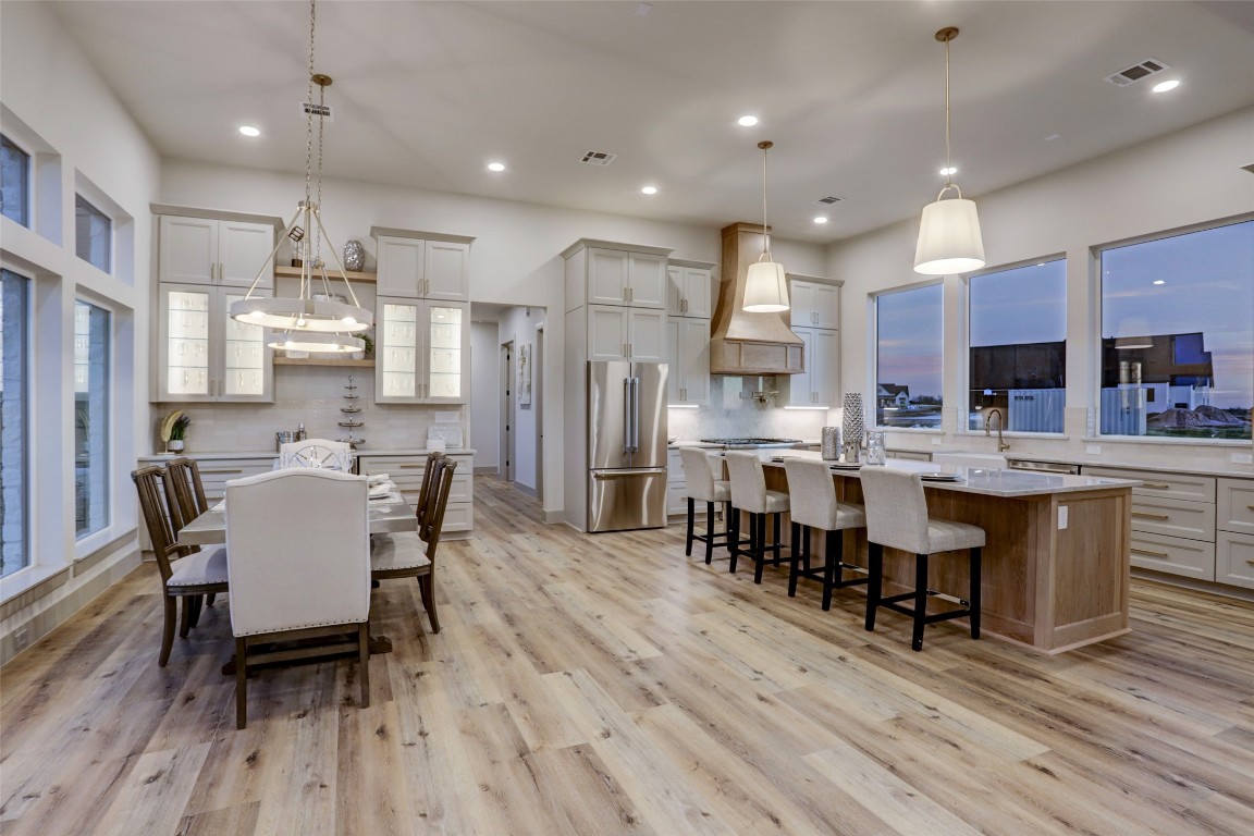 104 Turney Trace Round Top, TX 78954 - Photo 7 of 17 a large kitchen with a table and chairs