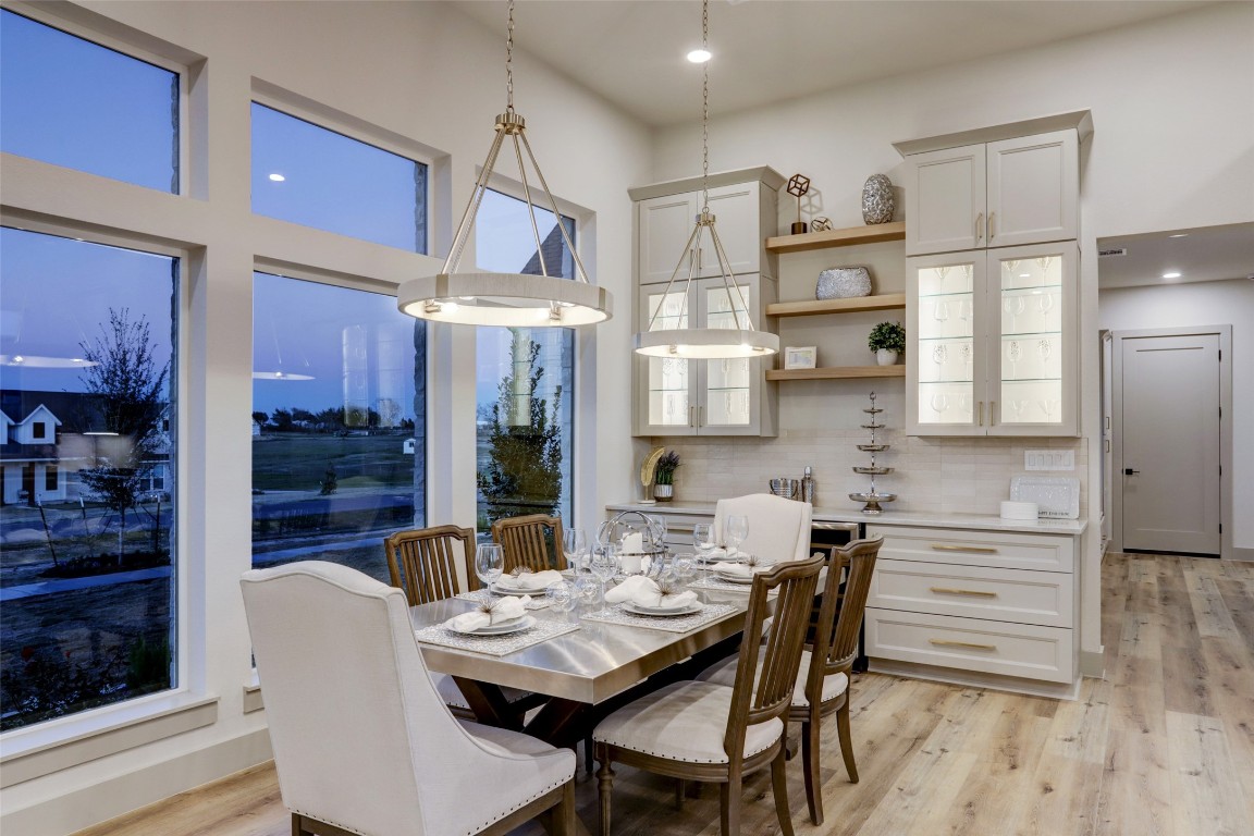 104 Turney Trace Round Top, TX 78954 - Photo 8 of 17 a dining room with furniture and wooden floor