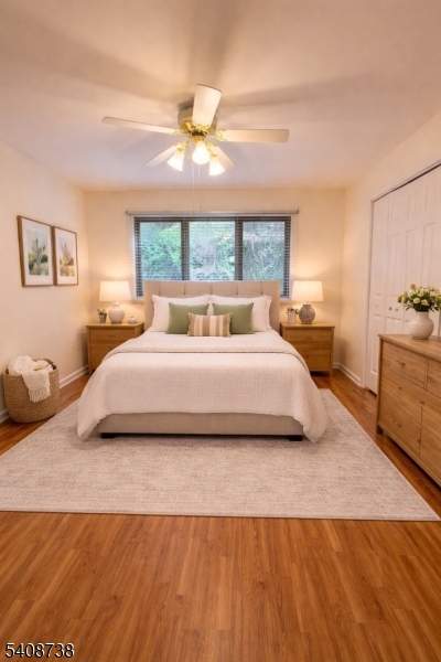 27 Espy Road, Unit A7 Caldwell, NJ 07006 - Photo 19 of 29 a bedroom with a large bed and a chandelier