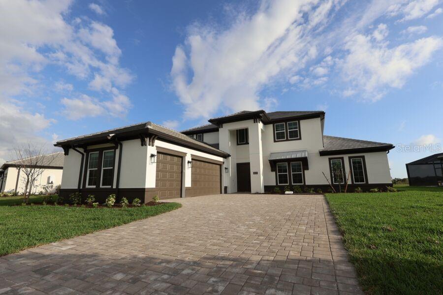 18528 Foxtail Loop Venice, FL 34293 - Photo 1 of 2 a front view of house with yard and green space