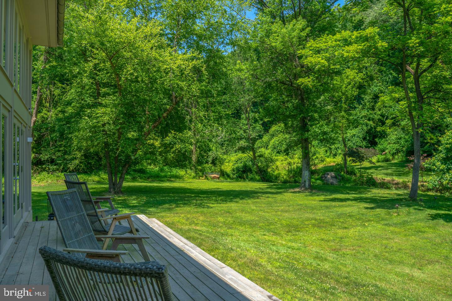 6024 Goshen Road Newtown Square, PA 19073 - Photo 11 of 15 a view of a deck with a table and chairs