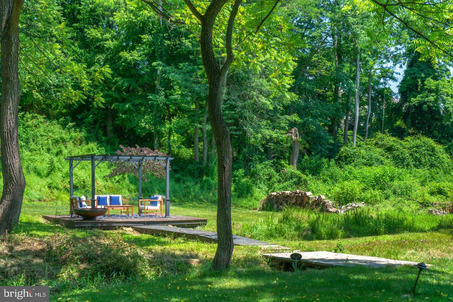 6024 Goshen Road Newtown Square, PA 19073 - Photo 12 of 15 a view of a table and chairs in the garden