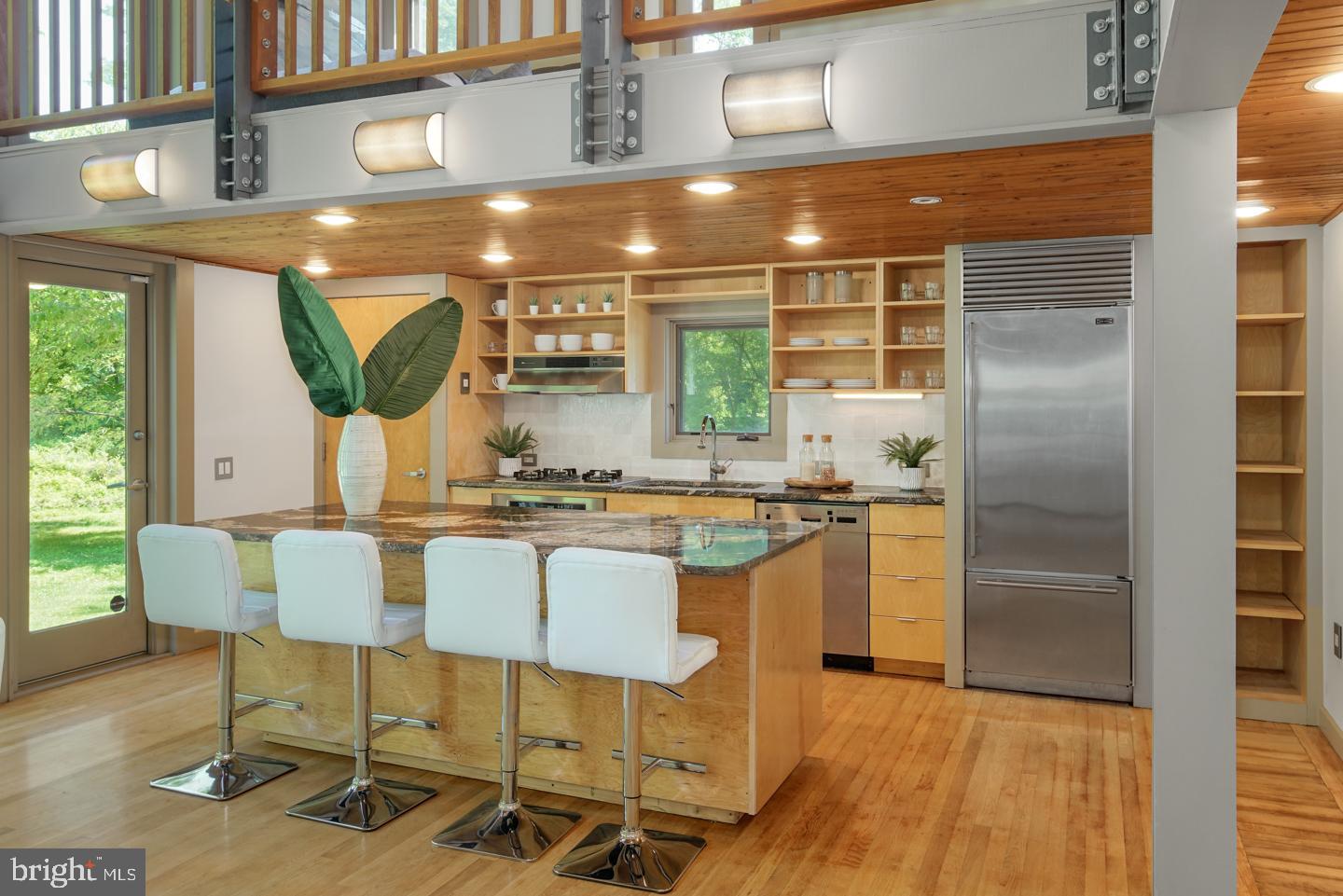 6024 Goshen Road Newtown Square, PA 19073 - Photo 4 of 15 a kitchen with a table chairs refrigerator and cabinets