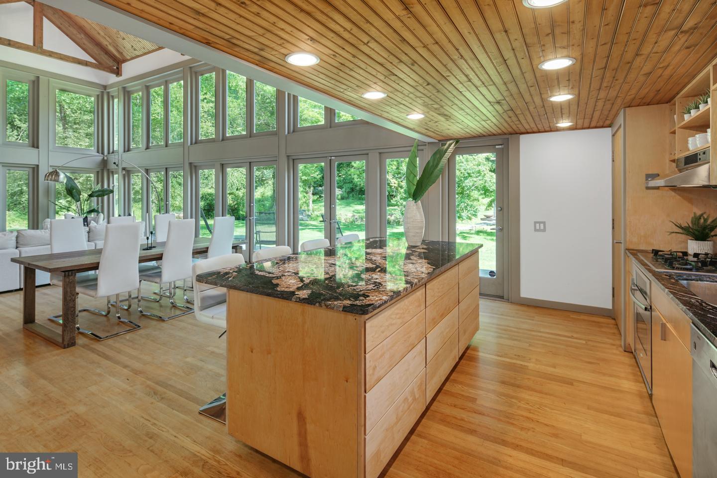 6024 Goshen Road Newtown Square, PA 19073 - Photo 5 of 15 a large kitchen with stainless steel appliances granite countertop a large counter top a stove and a refrigerator