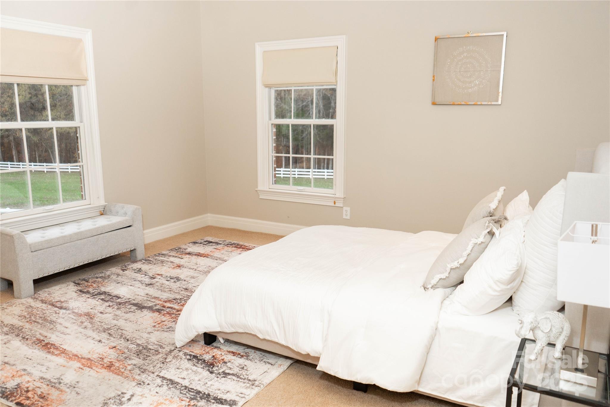 10600 Archer Road Davidson, NC 28036 - Photo 12 of 22 a bedroom with a bed and a window