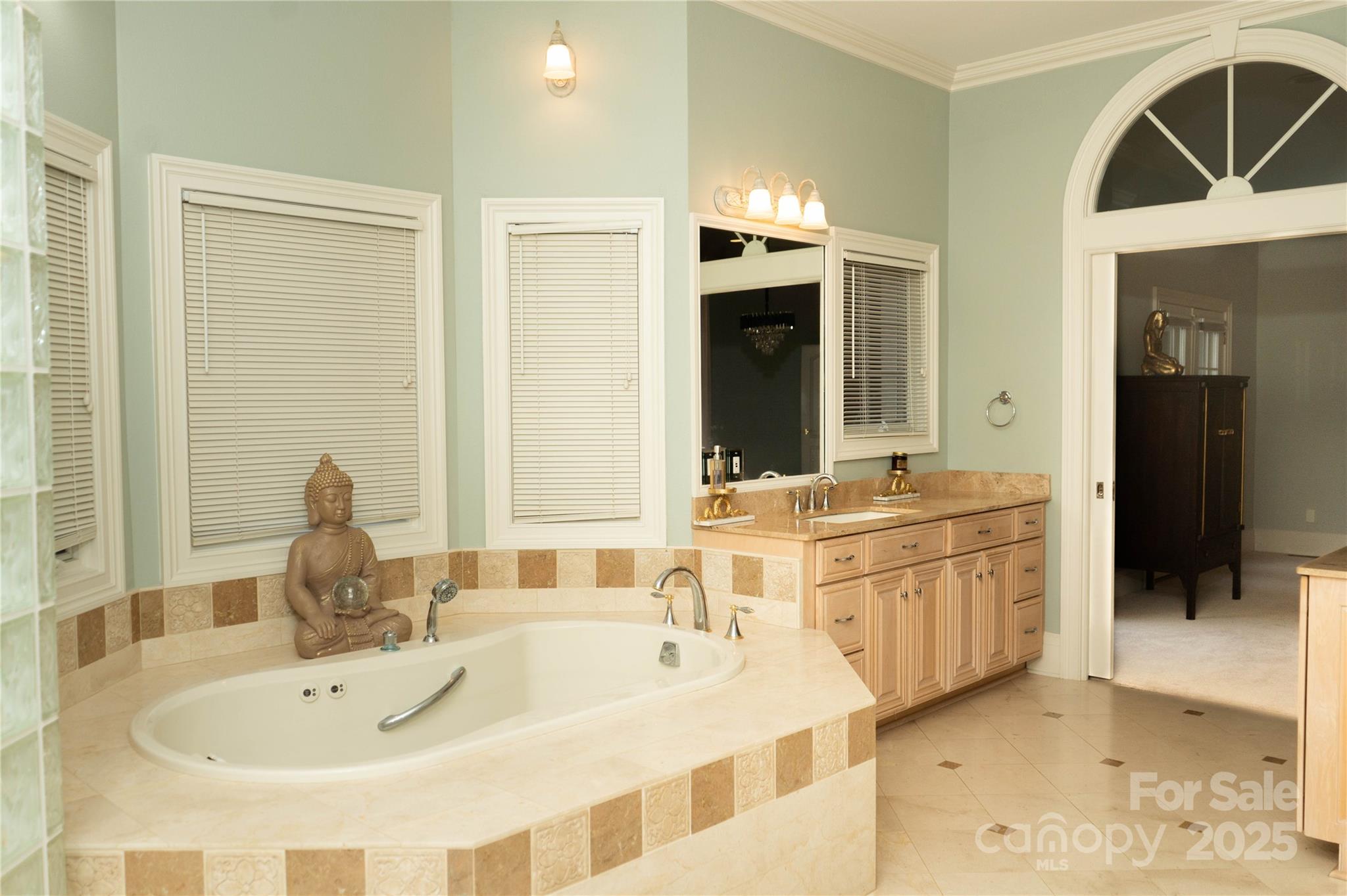 10600 Archer Road Davidson, NC 28036 - Photo 13 of 22 a bathroom with a double vanity sink a mirror and a bathtub