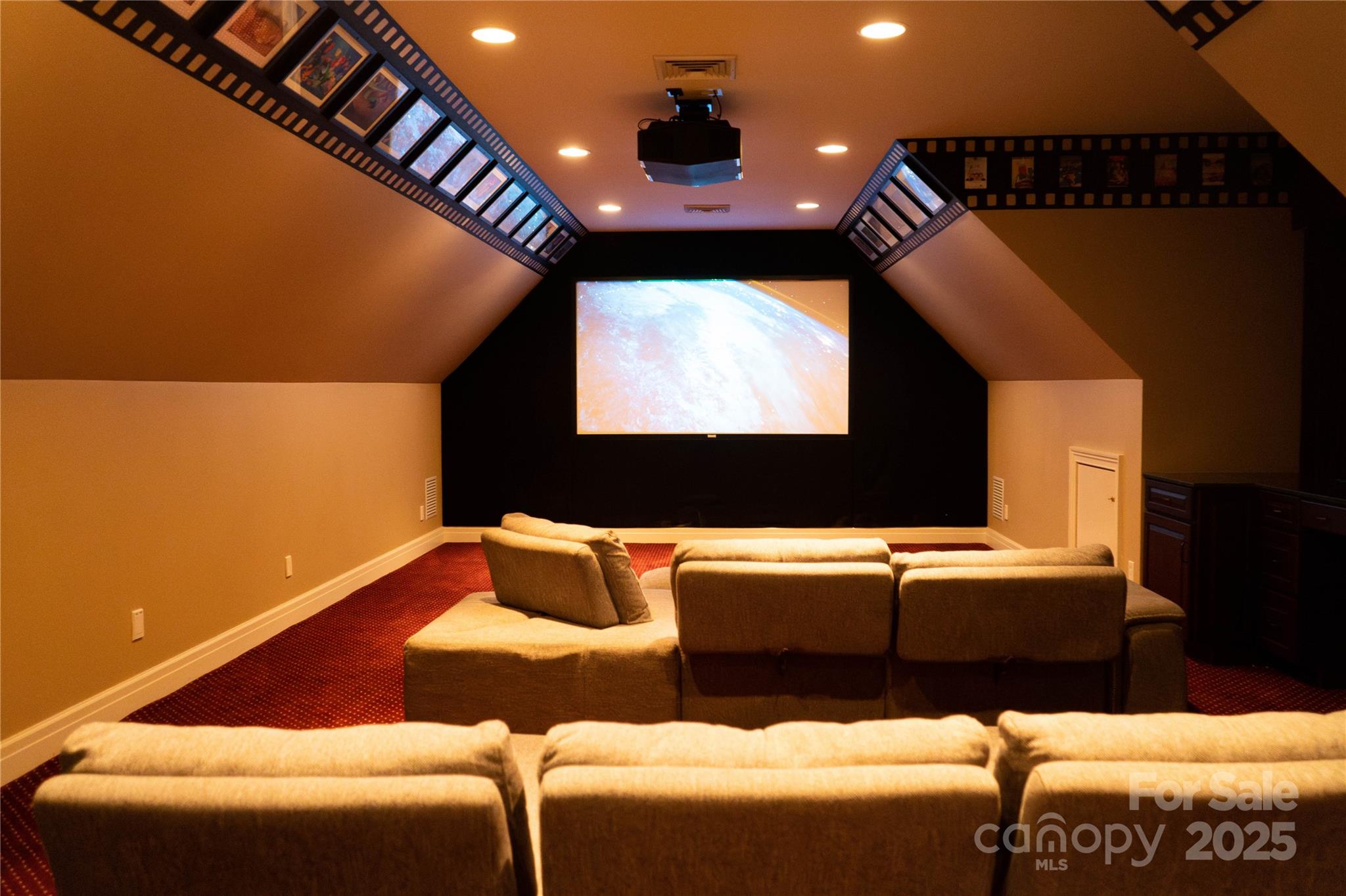 10600 Archer Road Davidson, NC 28036 - Photo 15 of 22 a projector room with a couch