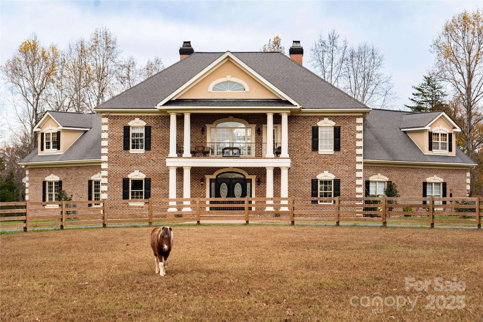 10600 Archer Road Davidson, NC 28036 - Photo 4 of 22 a front view of a house with a yard