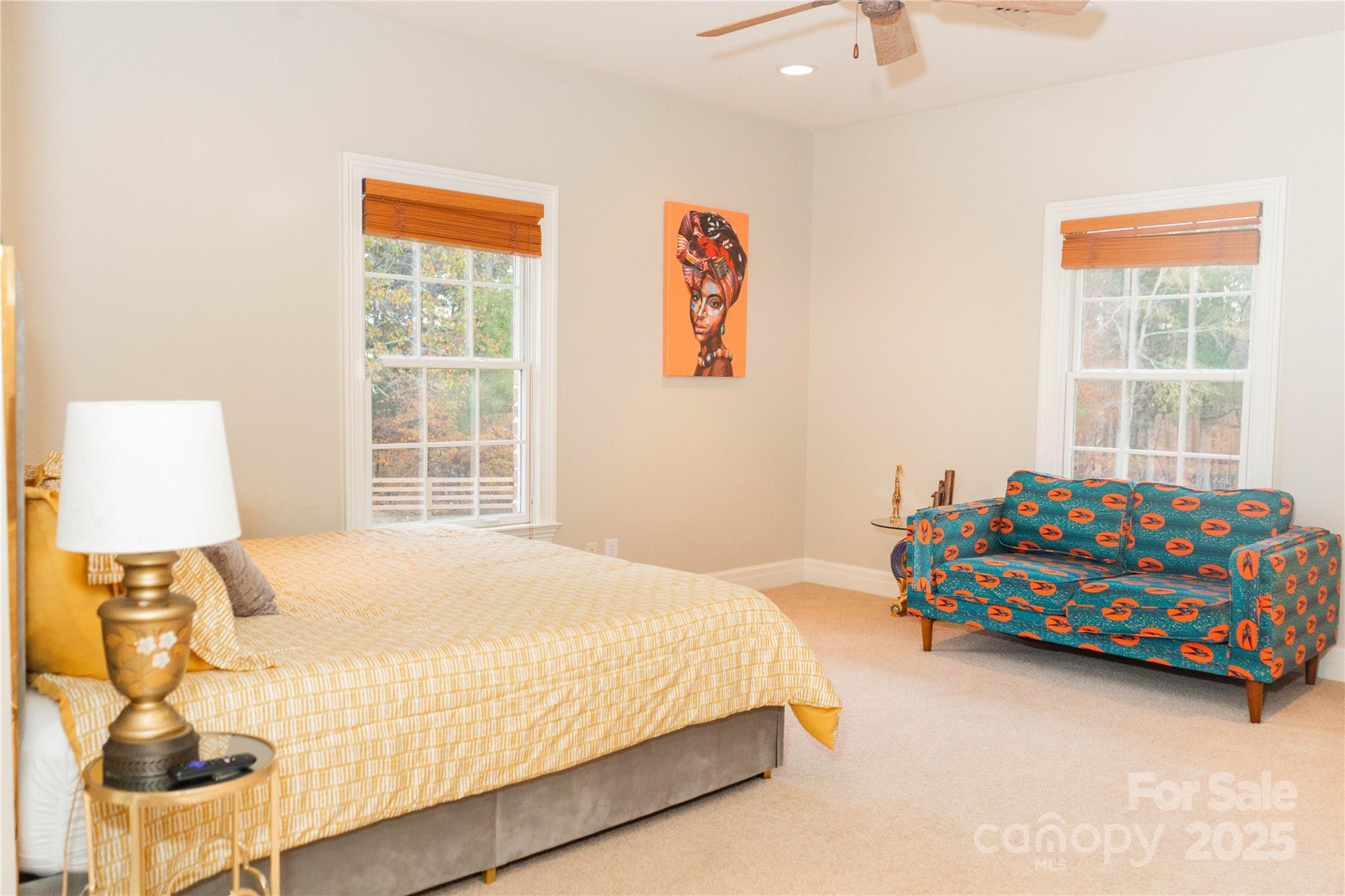 10600 Archer Road Davidson, NC 28036 - Photo 10 of 22 a bedroom with a bed and wooden floor