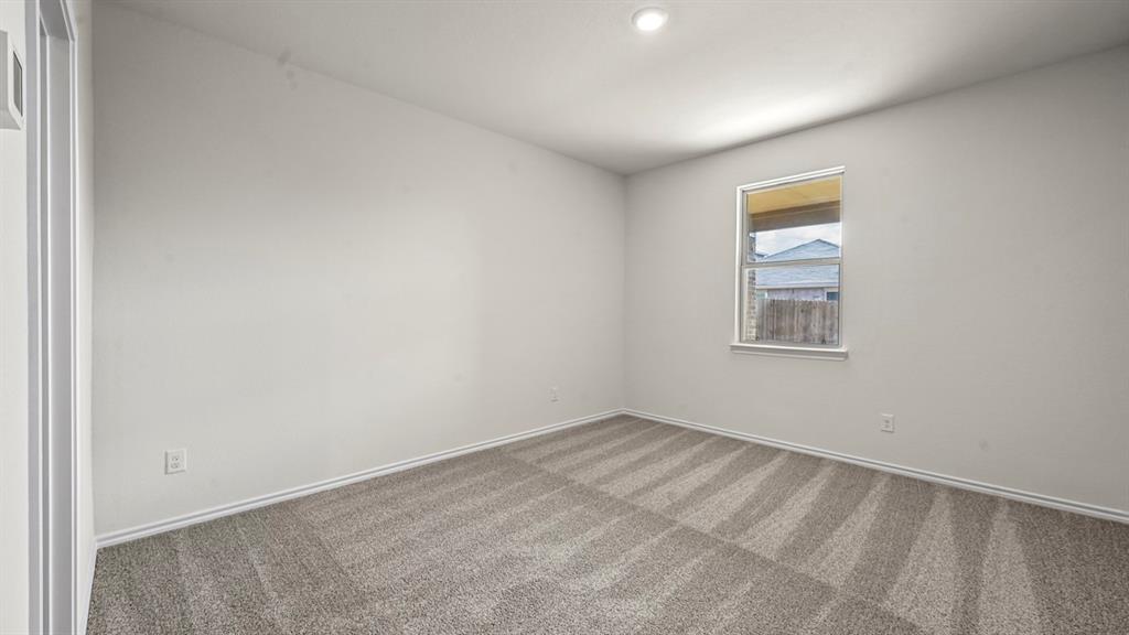 650 Glee Stem Road Lavon, TX 75166 - Photo 15 of 22 a view of an empty room with a window