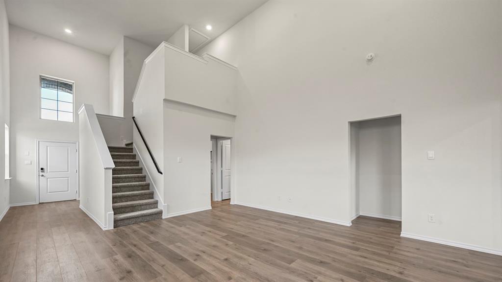 650 Glee Stem Road Lavon, TX 75166 - Photo 10 of 22 wooden floor in an empty room with a gallery