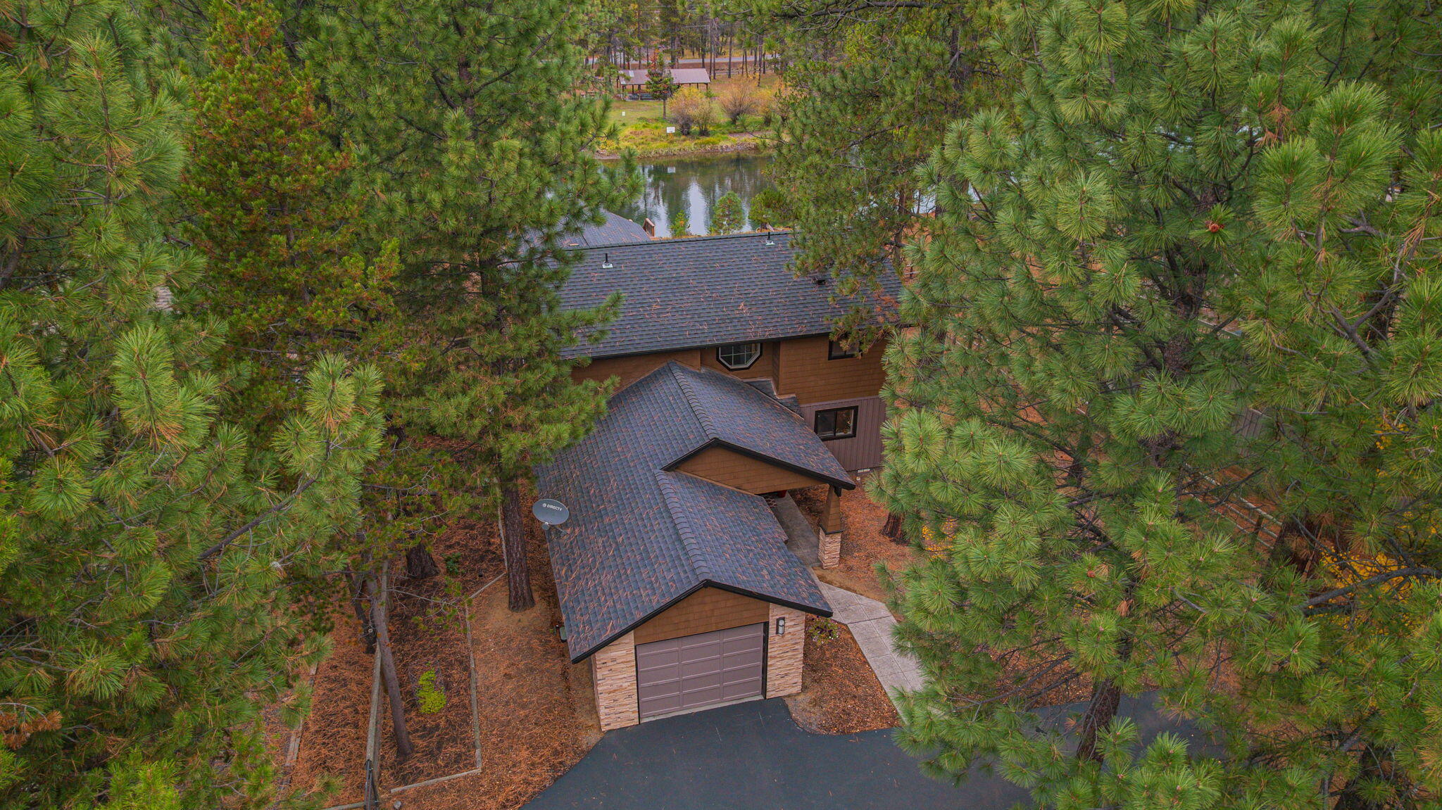 56019 Snow Goose Road Bend, OR 97707 - Photo 12 of 32 a view of a house with a yard and tree s