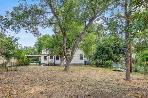 a house with trees in front of it