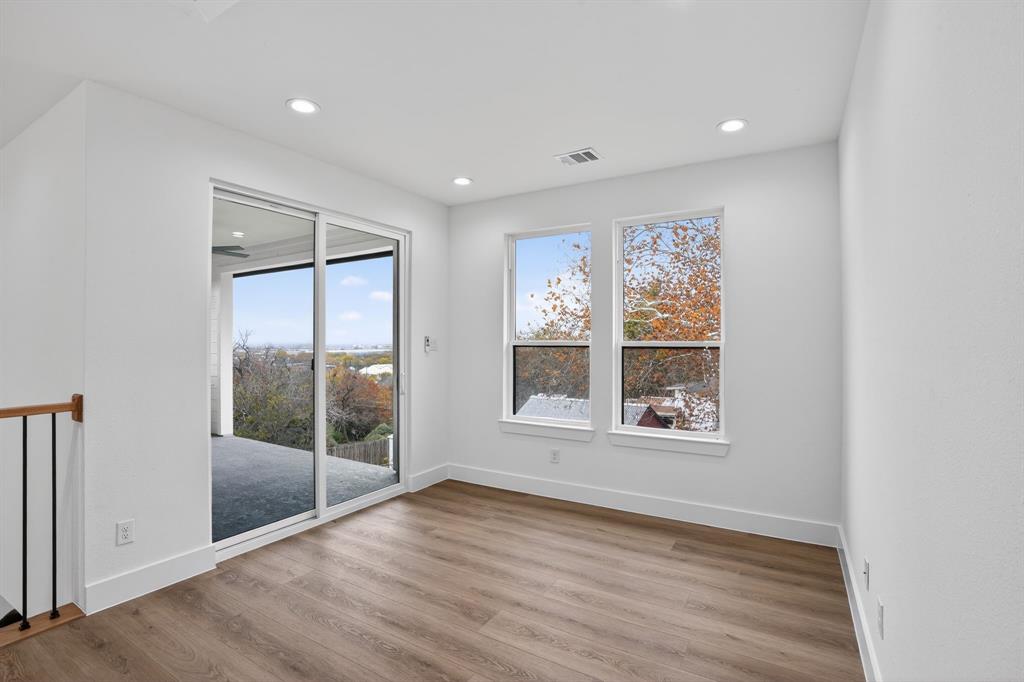 2007 North Montclair Avenue Dallas, TX 75208 - Photo 20 of 25 an empty room with wooden floor and windows