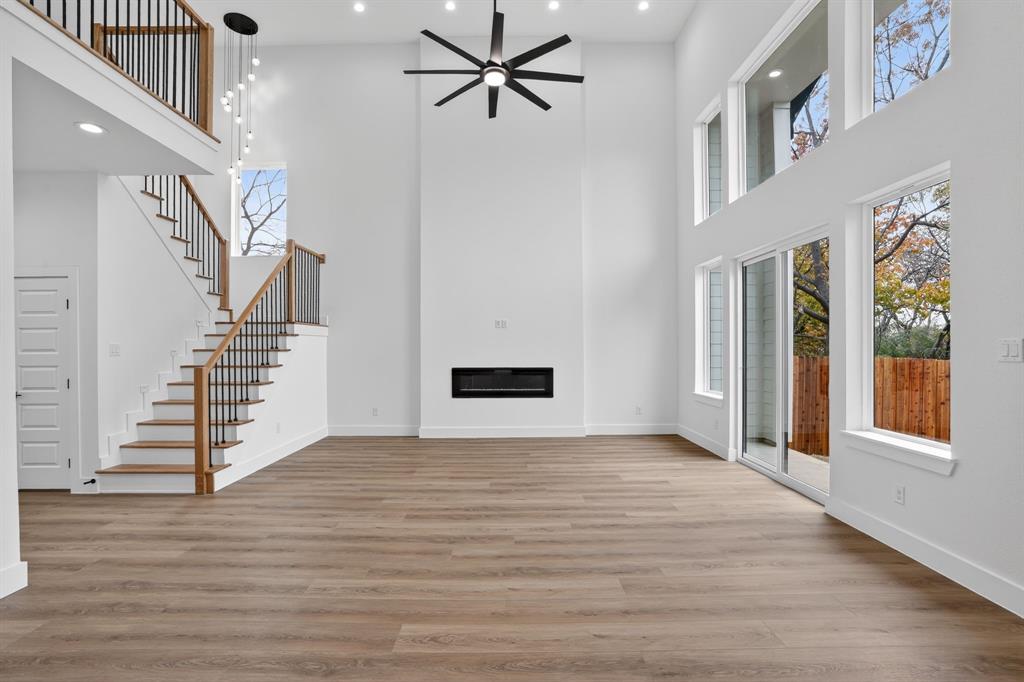 2007 North Montclair Avenue Dallas, TX 75208 - Photo 8 of 25 a view of an empty room with a window and wooden floor