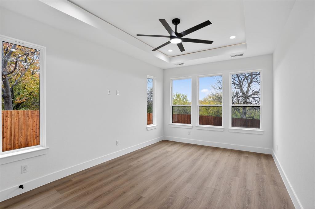 2007 North Montclair Avenue Dallas, TX 75208 - Photo 9 of 25 an empty room with wooden floor fan and windows