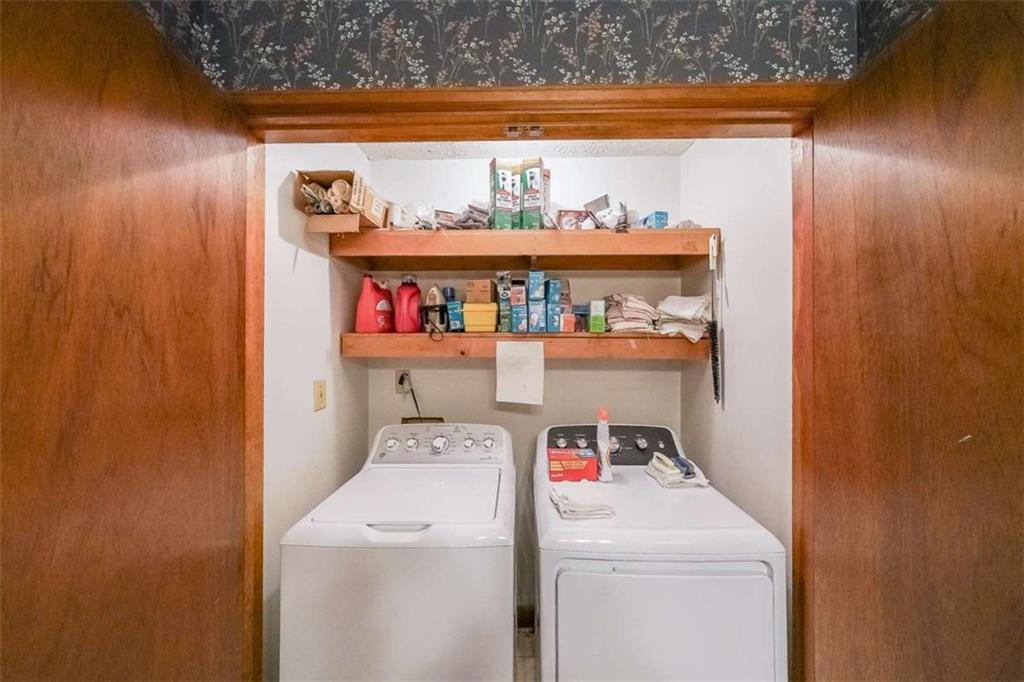 183 Timothy Lane Northwest Lilburn, GA 30047 - Photo 19 of 32 a utility room with dryer and washer