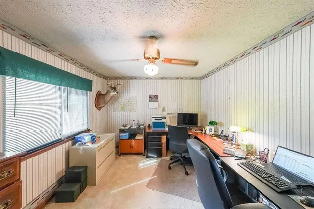 a workspace with furniture and a window