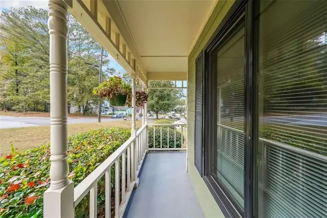 a view of balcony and wooden floor