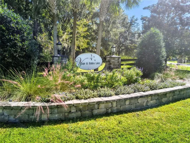 a view of a backyard with swimming pool