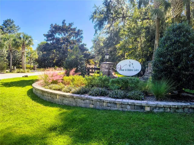 a view of a swimming pool with a yard