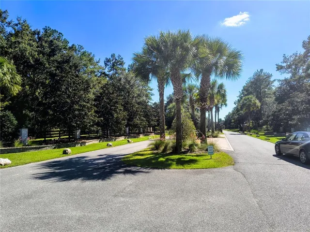 a view of a backyard with swimming pool