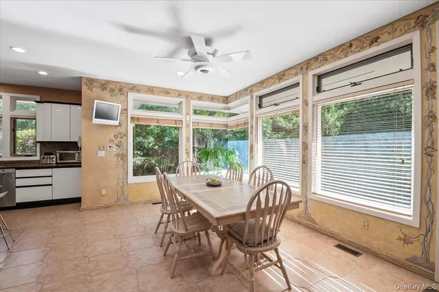 a dining room with furniture and window