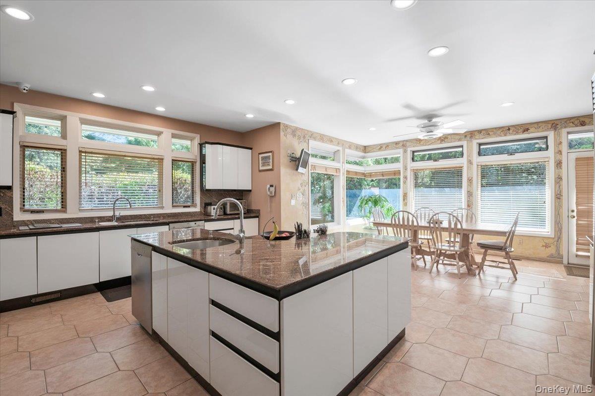 12 Ridge Court Glen Head, NY 11545 - Photo 15 of 46 a kitchen with center island next to a window