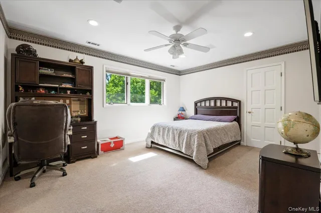 a bedroom with a bed and dresser